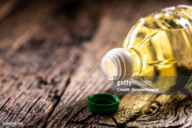 olive, sunflower or rapeseed oil in a plastic bottle, detail on the cap. - sunflower stock photos et images de collection