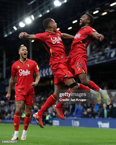 Emmanuel Dennis of Watford FC celebrates with teammate Joao Pedro after scoring their side's fifth goal during the Premier League match between...