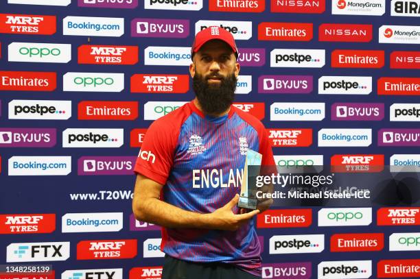 Moeen Ali of England poses after being named Player of the Match following the ICC Men's T20 World Cup match between England and Windies at Dubai...