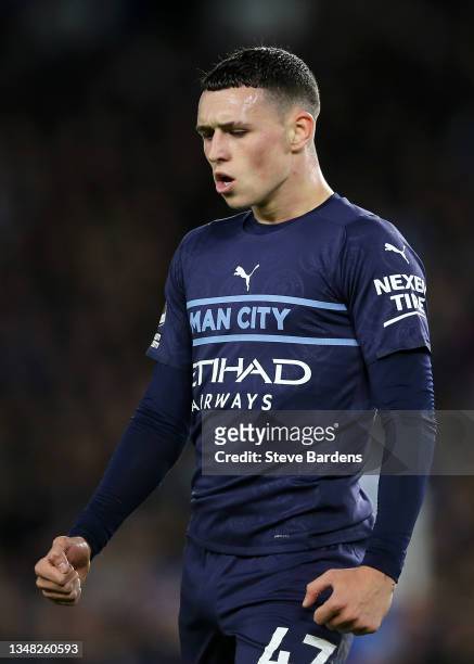Phil Foden of Manchester City celebrates after scoring their team's second goal during the Premier League match between Brighton & Hove Albion and...
