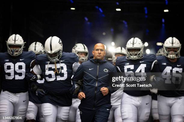 Head coach James Franklin of the Penn State Nittany Lions leads the team onto the field before the game against the Illinois Fighting Illini at...