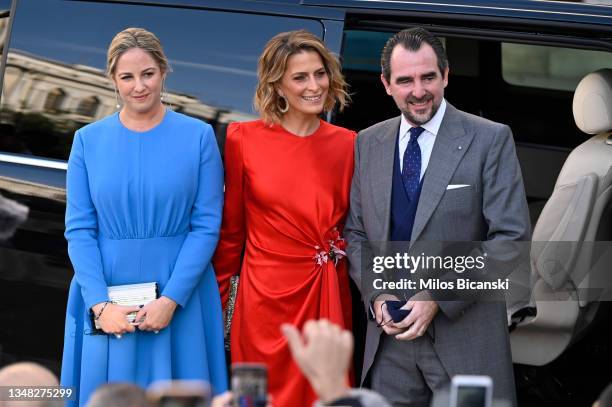 Princess Theodora, Princess Tatiana and Prince Nikolaos arrive at the Athens Orthodox Cathedral following the wedding ceremony of Nina Flohr and...