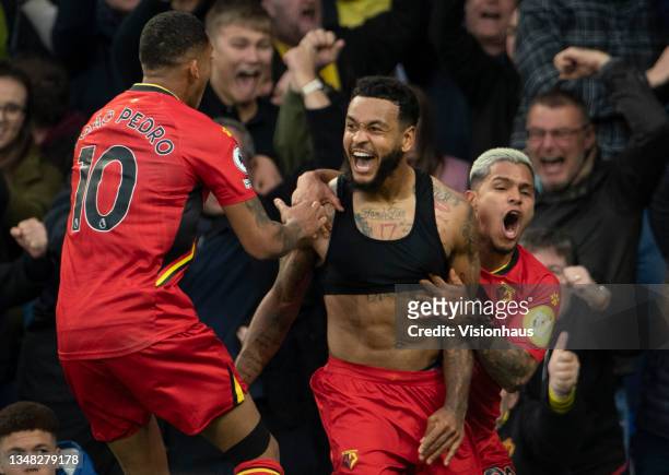 Joshua King of Watford celebrates scoring their third goal goal and his second during the Premier League match between Everton and Watford at...