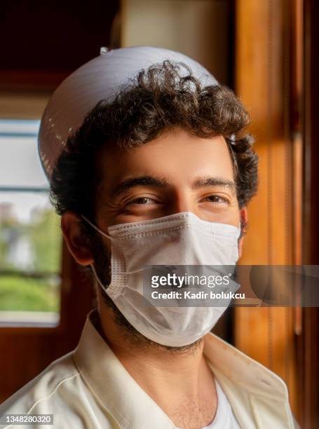 portrait of imam with face protection mask. - imam stock pictures, royalty-free photos & images