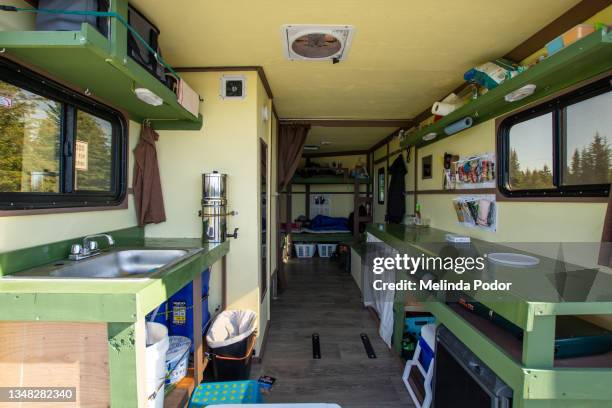 the inside of a cargo trailer converted into a camper - トレーラハウス ストックフォトと画像