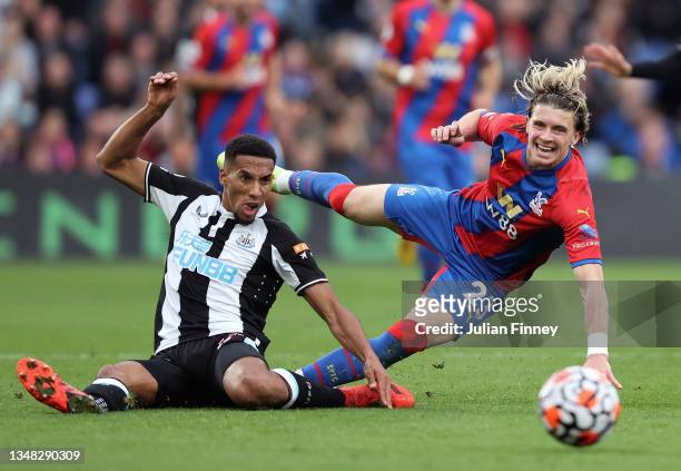 Conor Gallagher of Crystal Palace is challenged by Isaac Hayden of Newcastle United during the Premier League match between Crystal Palace and...