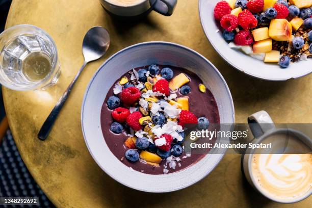 acai bowl with fresh fruits and berries, directly above view - acai ストックフォトと画像