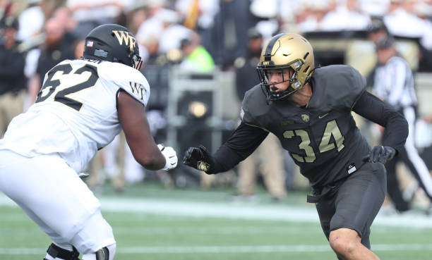 Andre Carter II of the Army Black Knights applies pressure against DeVonte Gordon of the Wake Forest Demon Deacons during the game at Michie Stadium...