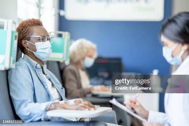 doctor talking with a cancer patient - medical research stock pictures, royalty-free photos & images