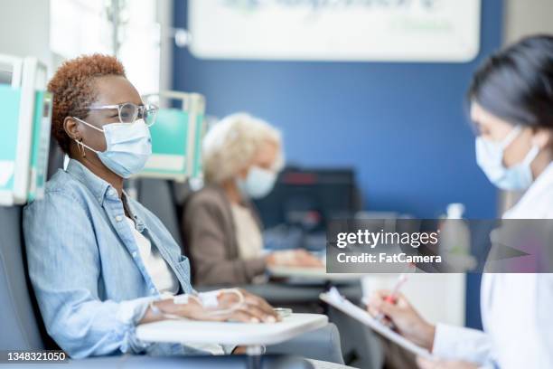 doctor talking with a cancer patient - medical research patient stock pictures, royalty-free photos & images