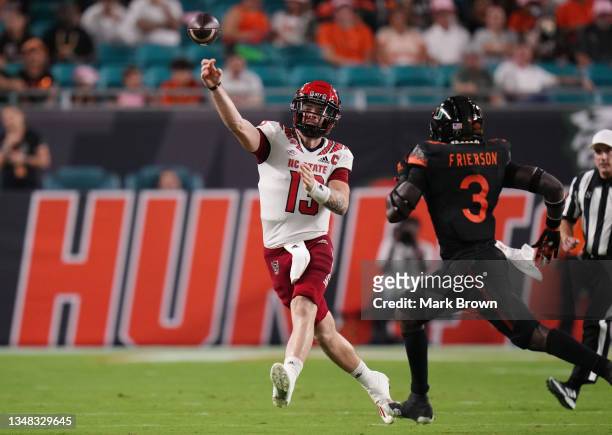 Devin Leary of the North Carolina State Wolfpack throws a pass against the Miami Hurricanes during the first half at Hard Rock Stadium on October 23,...