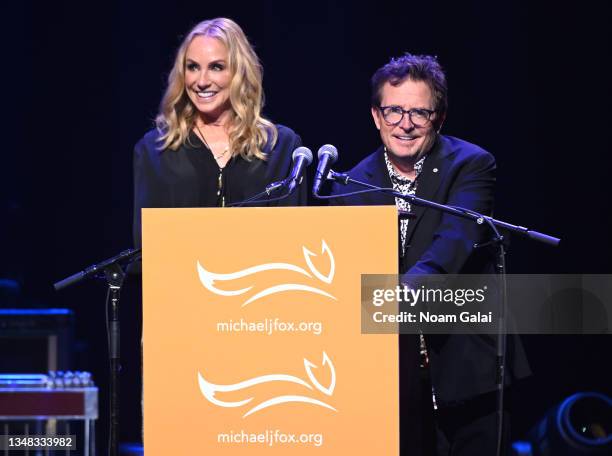 Tracy Pollan and Michael J. Fox speak onstage during the 2021 A Funny Thing Happened On The Way To Cure Parkinson's gala on October 23, 2021 in New...