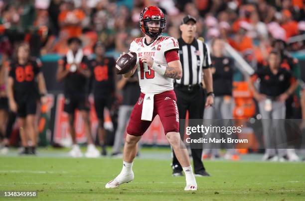 Devin Leary of the North Carolina State Wolfpack looks to pass against the Miami Hurricanes during the second half at Hard Rock Stadium on October...