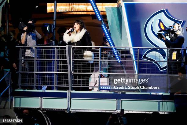 Musician Ann Wilson sings the national anthem prior to the inaugural home opening game between the Seattle Kraken and the Vancouver Canucks on...