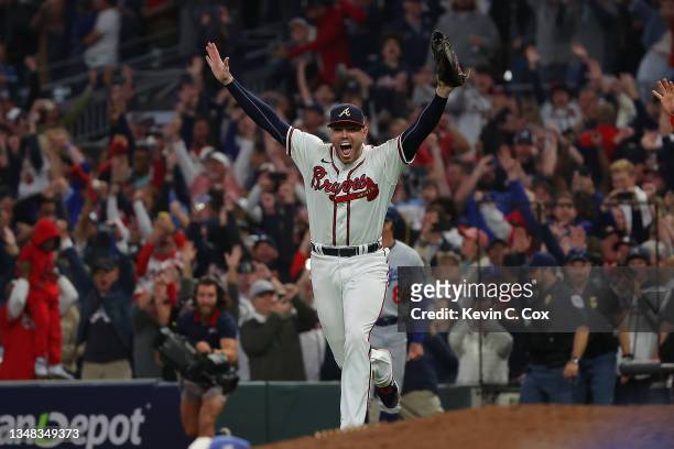 Freddie Freeman of the Atlanta Braves celebrates after defeating the Los Angeles Dodgers in Game Six of the National League Championship Series at...