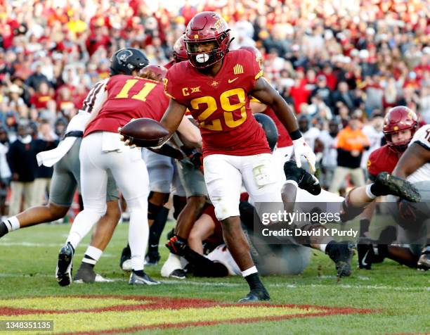 Running back Breece Hall of the Iowa State Cyclones drives in a touchdown in the second half of play at Jack Trice Stadium on October 23, 2021 in...