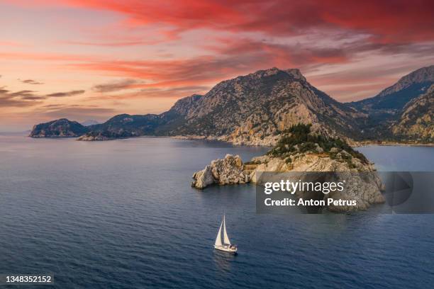 yacht in the open sea at sunset. yachting, luxury vacation at sea - sailing greece photos et images de collection