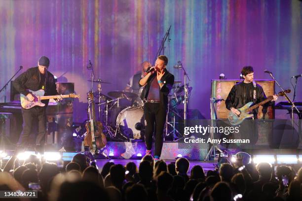 Jonny Buckland, Will Champion, Chris Martin, and Guy Berryman of Coldplay performs onstage during the 8th annual "We Can Survive" concert hosted by...