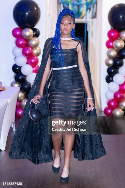 Model walks the runway during the GY6 Showcase at FTM Fashion Week Season 9 at the Jacksonville Onslow Council for the Arts on October 23, 2021 in...