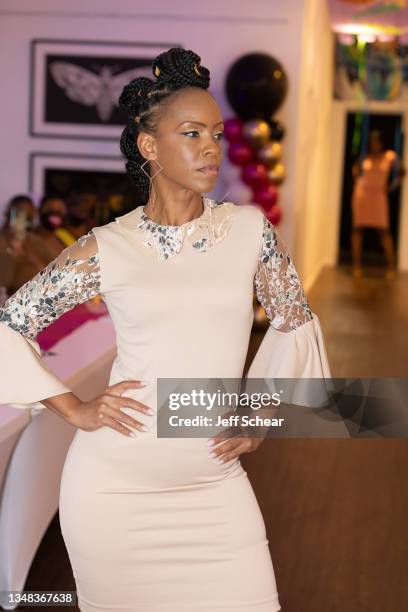 Model walks the runway during the Couture Showcase at the Different Regard fashion show at FTM Fashion Week Season 9 at the Jacksonville Onslow...
