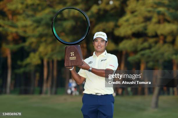 Hideki Matsuyama of Japan poses with the trophy after winning the tournament following the final round of the ZOZO Championship at Accordia Golf...