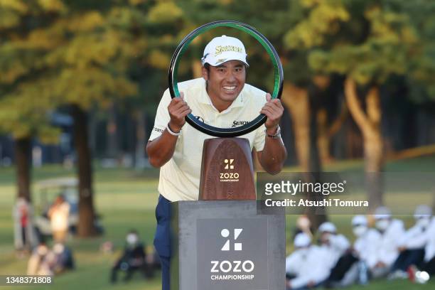 Hideki Matsuyama of Japan poses with the trophy after winning the tournament following the final round of the ZOZO Championship at Accordia Golf...