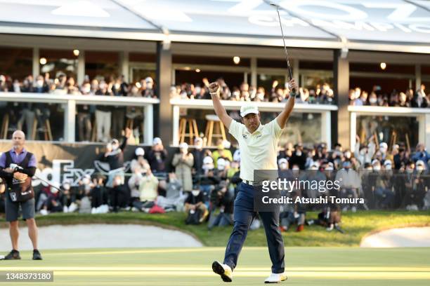 Hideki Matsuyama of Japan celebrates winning the tournament on the 18th green during the final round of the ZOZO Championship at Accordia Golf...