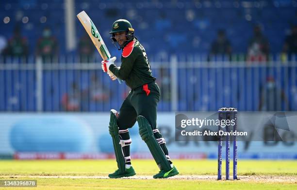 Shakib Al Hasan of Bangladesh plays a shot during the ICC Men's T20 World Cup match between Sri Lanka and Bangladesh at Sharjah Cricket Stadium on...