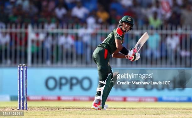 Afif Hossain of Bangladesh plays a shot during the ICC Men's T20 World Cup match between Sri Lanka and Bangladesh at Sharjah Cricket Stadium on...