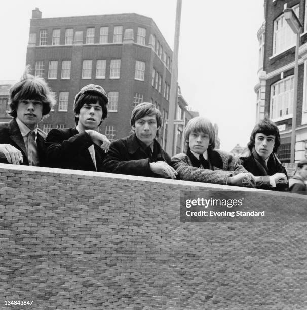 The Rolling Stones posed next to Centrepoint on Charing Cross Road, London, 19th March 1964. Left to right: Mick Jagger, Keith Richards, Charlie...