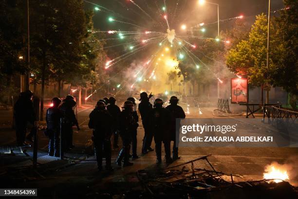 Police stand by as material explodes in the Cite Pablo Picasso area of Nanterre, north-west of Paris early June 30 as protests continue across France...