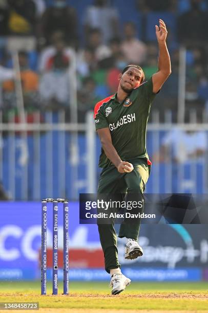 Mohammad Saifuddin of Bangladesh in bowling action during the ICC Men's T20 World Cup match between Sri Lanka and Bangladesh at Sharjah Cricket...