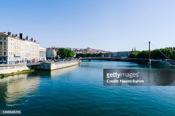 blue saône river and old footbridge, lyon, france, on a sunny day - rhone river stock pictures, royalty-free photos & images