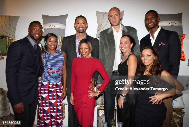 Dwyane Wade, Gabrielle Union, Juwan Howard, Janine Howard, Zydrunas Ilgauskas, Jennifer Ilgauskas, Chris Bosh and Adrienne Bosh attend "Unlock" Art...