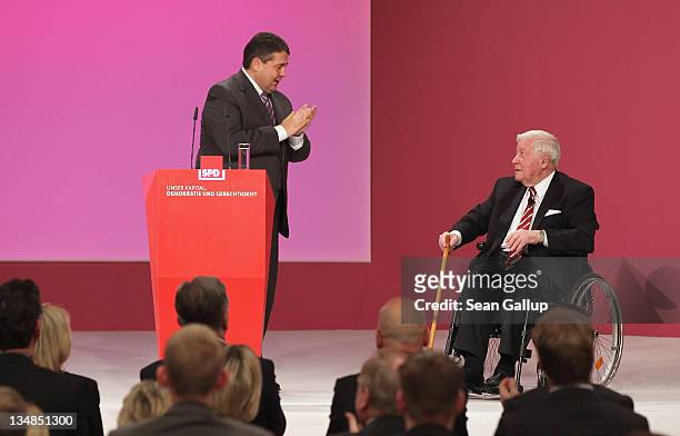 Sigmar Gabirel ; Chairman of the German Social Democrats , congratulates former German Chancellor Helmut Schmidt after Schmidt spoke at the SPD...