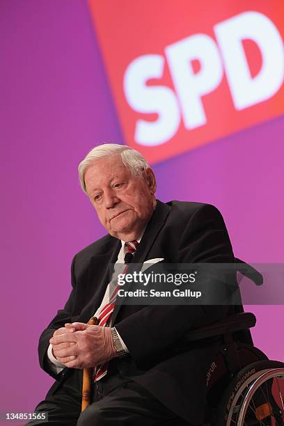 Former German Chancellor Helmut Schmidt arrives to speak at the annual federal congress of the German Social Democrats on December 4, 2011 in Berlin,...