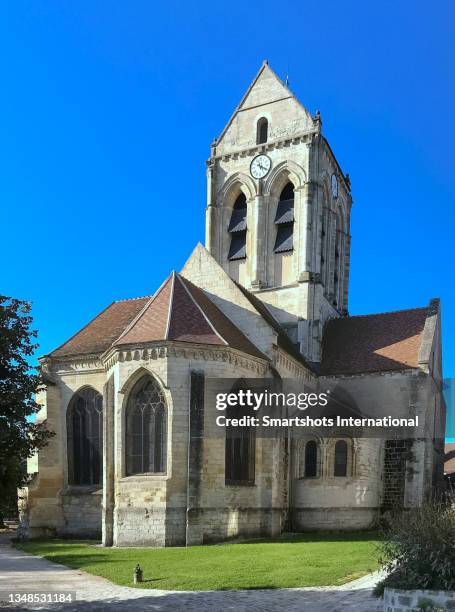 church in auvers sur oise (famous "eglise d'auvers") in france as painted by vincent van gogh in 1890 under the impressionist style - auvers sur oise ストックフォトと画像