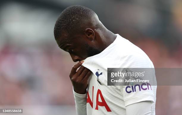 Tanguy Ndombele of Tottenham Hotspur reacts as he leaves the pitch after being substituted during the Premier League match between West Ham United...