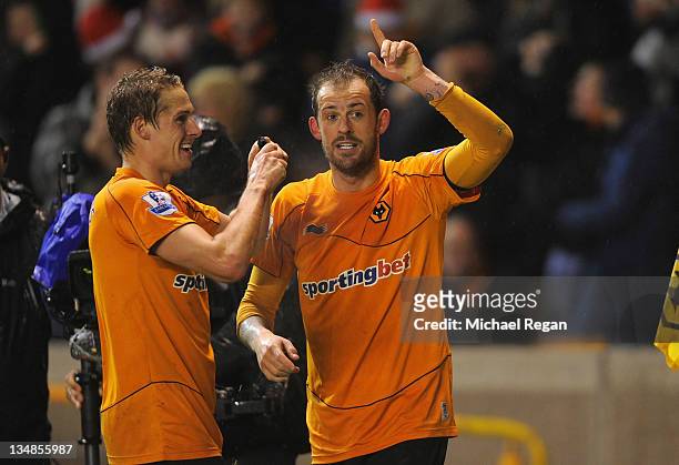 Steven Fletcher of Wolves celebrates scoring to make it 1-1 with team mate David Edwards during the Barclays Premier League match between...
