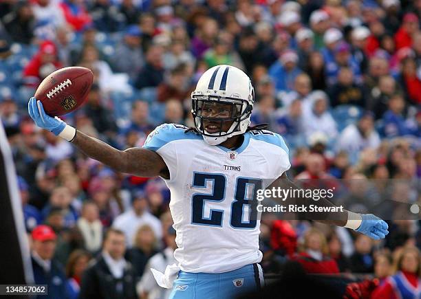 Chris Johnson of the Tennessee Titans scores his second touchdown of the game in the first half against the Buffalo Bills at Ralph Wilson Stadium on...