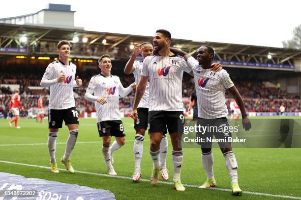 Aleksandar Mitrovic of Fulham celebrates with Neeskens Kebano and team mates after scoring their side's fourth goal during the Sky Bet Championship...