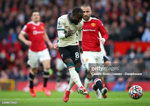 Naby Keita of Liverpool scores his teams first goal during the Premier League match between Manchester United and Liverpool at Old Trafford on...