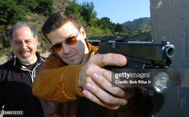 Bones" TV show actor David Boreanz gets firearm gun handling training from the show's technical advisor Mike Grasso, as they practice body and gun...