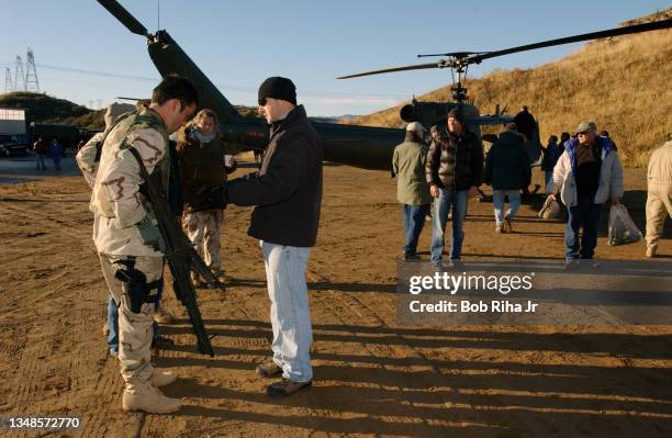 Camera crew films helicopter scene with actor Anthony Lapaglia and Enrique Murciano on location filming north of Los Angeles of an episode of...