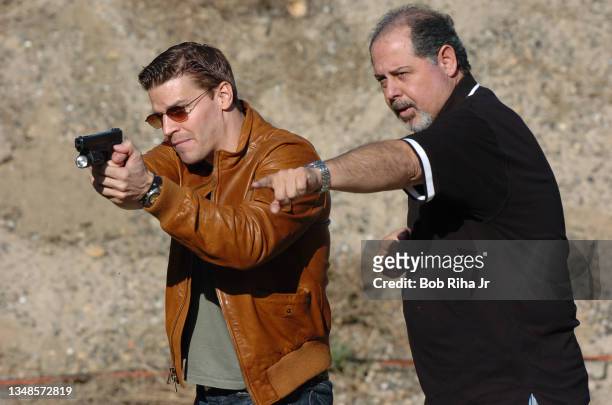 Bones" TV show actor David Boreanz gets firearm gun handling training from the show's technical advisor Mike Grasso, as they practice body and gun...