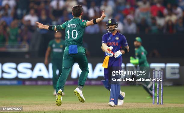 Shaheen Afridi of Pakistan celebrates the wicket of Virat Kohli of India during the ICC Men's T20 World Cup match between India and Pakistan at Dubai...