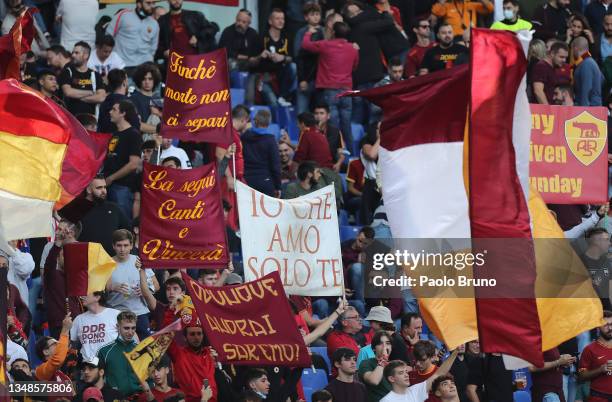 Fans of AS Roma show their support as they wave flags and banners prior to the Serie A match between AS Roma and SSC Napoli at Stadio Olimpico on...