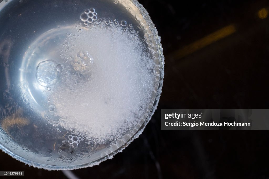 Delicious, cold, refreshing Margarita alcoholic drink with salted glass rim, top down view - Tepoztlan, Mexico
