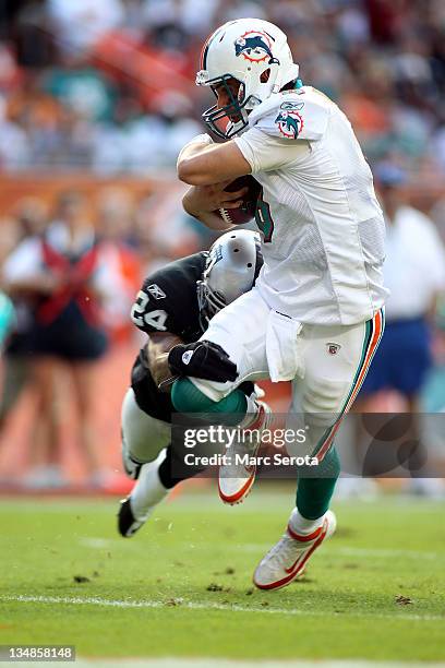 Quarterback Matt Moore of the Miami Dolphins scrambles for a touchdown against the Oakland Raiders at Sun Life Stadium on December 4, 2011 in Miami...