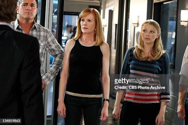 Zippered”-- From left are Nick Stokes , Catherine Willows and Morgan Brody all look serious as they listen to the FBI as they are assigned to help...